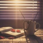 10 Powerful Devotional Mantras to Start Your Day with Positivity Sunrise with coffee, prayer beads, and journal.