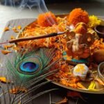 Why Hindu Devotion Inspires Spiritual Strength Worldwide Puja thali with Ganesha idol and peacock feather.