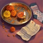 Healing Practices from Hindu Traditions You Can Try Puja thali with marigold petals, diya, mantra, and sock.