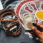 Ancient Spiritual Symbols in Daily Life: My Rambling, Kinda Cringey Ramble Spiritual items with a laptop charger and rangoli.